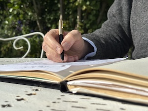 Picture of celebrant writing in notebook